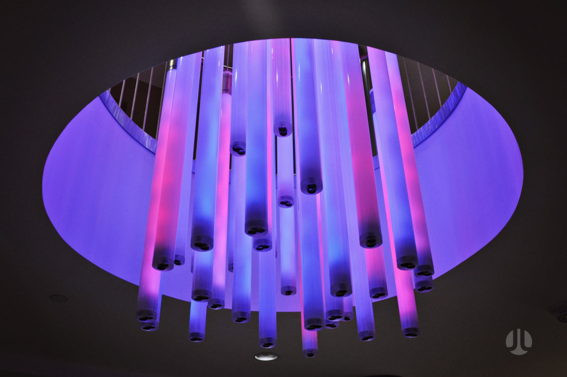 The illuminated interactive tubes of the Flux Chandelier by light artist Jen Lewin