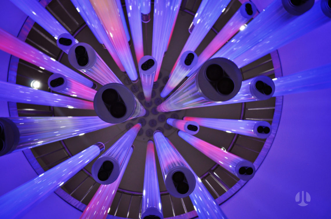Looking up at the interactive Flux Chandelier by light artist Jen Lewin