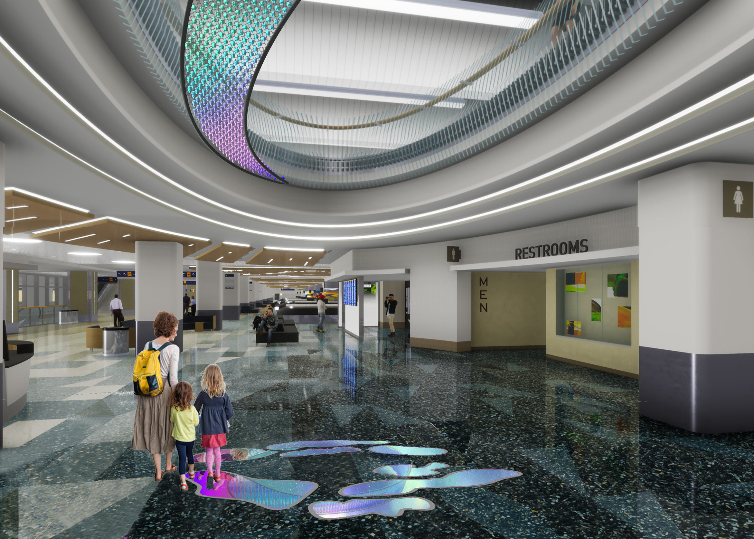 The Aurora (2021) by Jen Lewin is an experiential, 29-foot-tall glass and metal sculpture suspended through an oval opening between the ticketing and baggage claim levels in Terminal 1 of Minneapolis–Saint Paul International Airport. The twisting wave is composed of over 20,000 aluminum rings, holds approximately 1,900 hand-blown glass bulbs with embedded LEDs, and is programmed to change color in real time based on weather conditions in Minneapolis (e.g. cool blues and whites for colder weather, greens and yellows in spring, warmer tones in fall). Beneath the sculpture, an array of eight touch-responsive glass “lake” platforms—shaped like area lakes—translate footsteps or gestures into swirling light and color beneath one’s feet, creating a dialogue between the sculpture above and interactive ground surfaces below. The work marries art, environment, and human interaction, drawing inspiration from the natural aurora phenomena while anchoring the airport space with joy, movement, and connection.